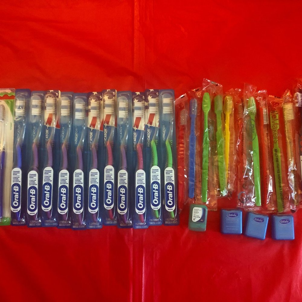 Large Bundle of New Toothbrushes & Flosses